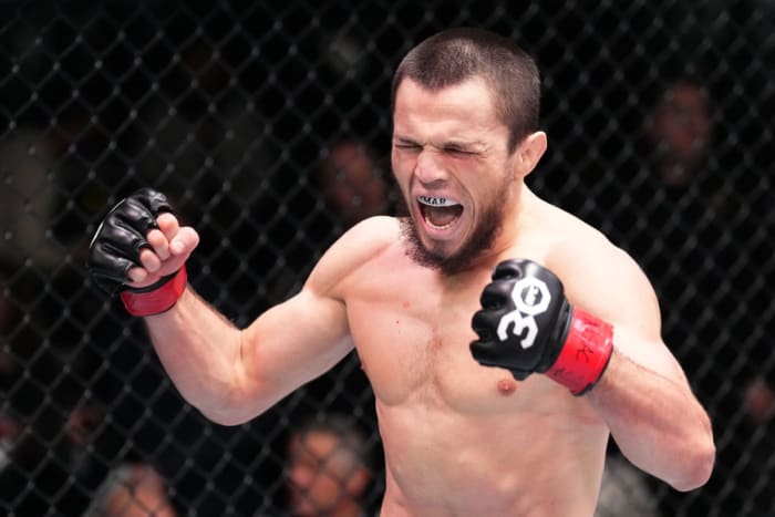 Umar Nurmagomedov celebrates a victory inside the UFC Octagon.